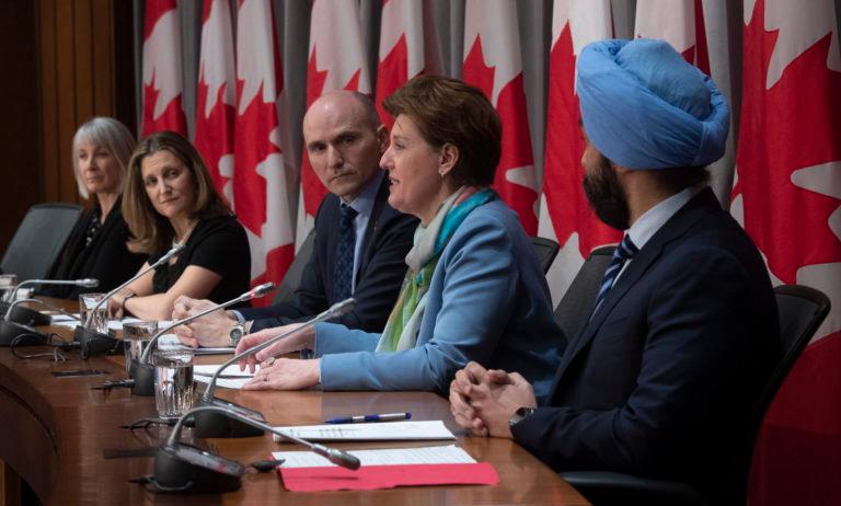 Cabinet ministers attend a news conference on the COVID-19 crisis in Ottawa on March 23, 2020 (Adrian Wyld/CP)