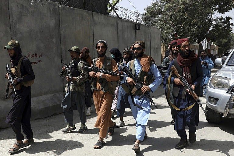 Taliban fighters patrol in Wazir Akbar Khan neighborhood in the city of Kabul on Aug. 18, 2021 (AP Photo/Rahmat Gul)