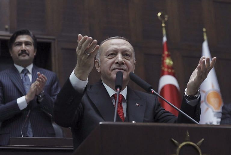 Erdogan addresses his ruling party members at the parliament, in Ankara, Turkey, on Feb. 12, 2020 (AP Photo/Burhan Ozbilici)