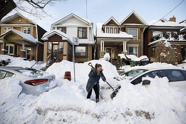 A local resident shovels snow after A local resident shovels snow after a snowstorm in Toronto, Ontario, Canada, on Tuesday, Jan. 18, 2022. Toronto Mayor John Tory declared a "major snowstorm condition" and said it would take at least 72 hours clear the city of snow. (Cole Burston/Bloomberg/Getty Images)a snowstorm in Toronto, Ontario, Canada, on Tuesday, Jan. 18, 2022. Toronto Mayor John Tory declared a "major snowstorm condition" and said it would take at least 72 hours clear the city of snow. Photographer: Cole Burston/Bloomberg via Getty Images