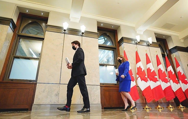 Chrystia Freeland and Justin Trudeau leave a press conference before the release of the federal budget, in Ottawa, April 7, 2022. (Sean Kilpatrick/The Canadian Press)