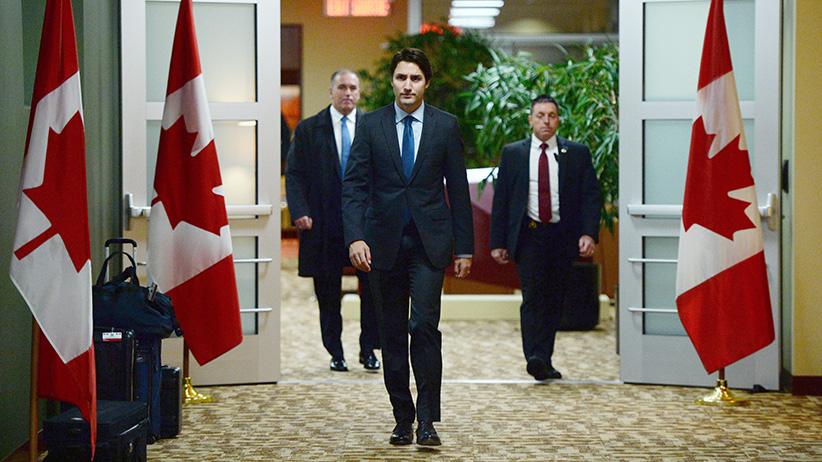 Canadian Prime Minister Justin Trudeau arrives to address the media on the terrorist attacks in Paris prior to his departure for the G20 and APEC summits from Ottawa, Friday November 13, 2015. Trudeau says Canada has offered all the support it can to France following Friday's attacks in Paris. (Sean Kilpatrick/CP)