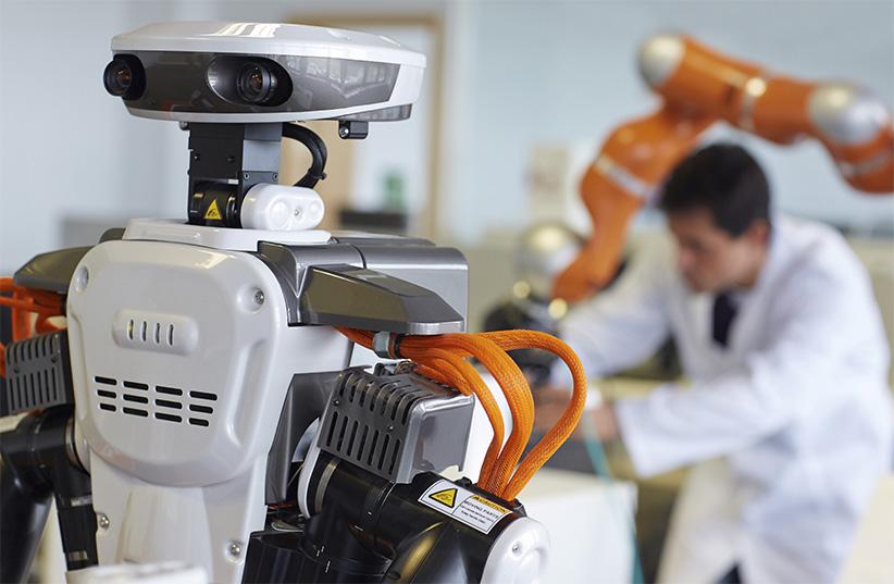 Humanoid robot for automotive assembly tasks in collaboration with people and LWR robot, using haptic teleoperation with force feedback Safety in human-robot cooperation Industry, Tecnalia Research, San Sebastian, Basque Country, Spain. (Javier Larrea/Getty Images)
