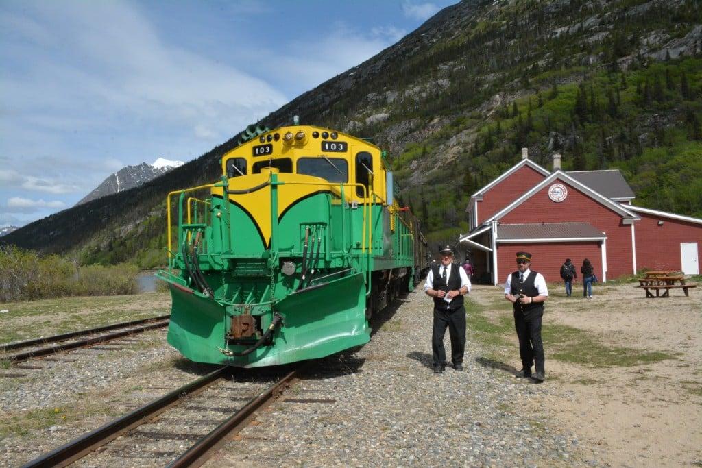 A train conductor and brakeman prepare for departure on the White Pass and Yukon Route Railroad in Bennett, B.C.