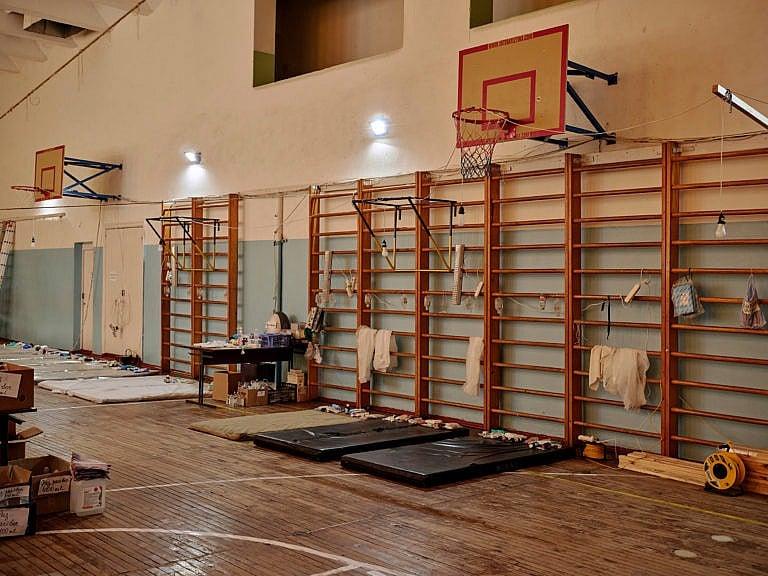 March 8, 2022. A school gym is converted into a makeshift field hospital. (Photograph by Philip Cheung)