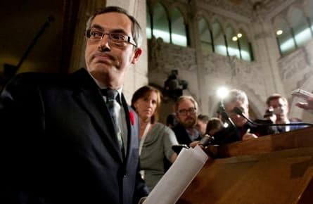 What is the Harper government’s policy on foreign investment?