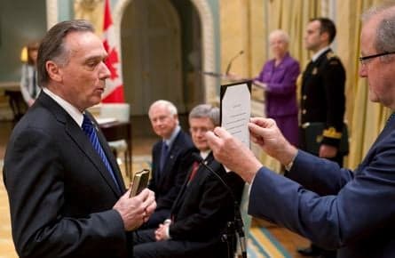 Harper shuffles his cabinet