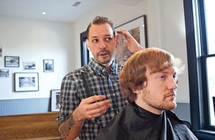 Why men's men are suddenly sporting the side sweep