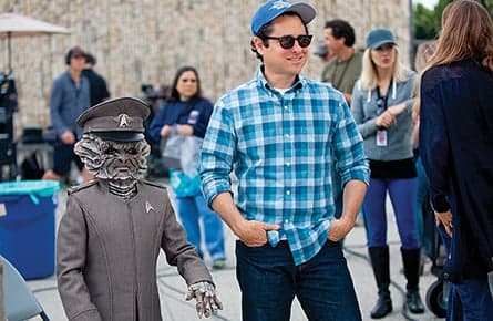 The man with Star Wars and Star Trek in his hands