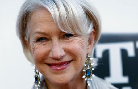 Helen Mirren, dressed as Queen Elizabeth, puts an end to noisy drumming
