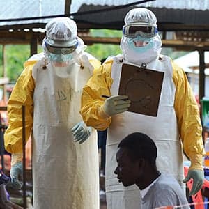 Why is the overwhelmed MSF in charge of the Ebola fight?