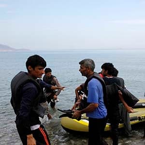 For some, Kos is a holiday island. For Syrian refugees, it's a waiting room.