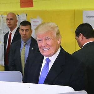 Amid heckling, Donald Trump casts his vote