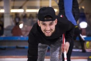 Refugees learn to curl for the first time