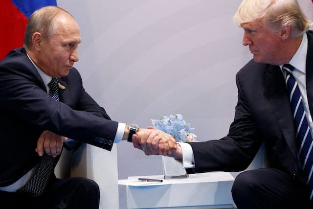 One picture, nearly 1,000 words: Trump and Putin shake on it