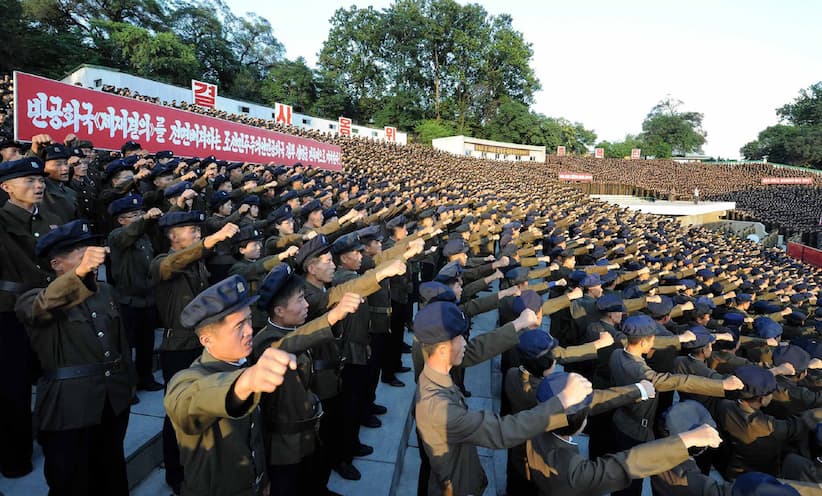 This picture taken on August 11, 2017 and released by North Korea's official Korean Central News Agency (KCNA) on August 12, 2017 shows North Korean youths and workers and trade union members holding a rally to protest the UN Security Council's "sanctions resolution" at the Youth Park Open-Air theatre in Pyongyang. (STR/AFP/Getty Images)