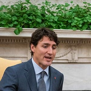 Watch Trudeau try not to react while listening to Trump in the White House