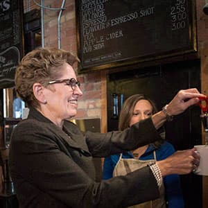 The minimum wage hike will cost Kathleen Wynne. But how much?