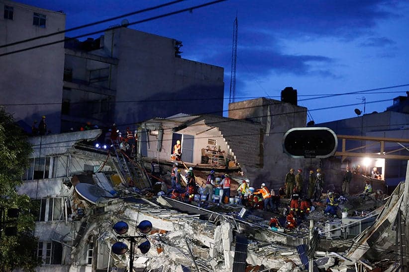 Rescuers race to save people believed to be still alive inside a collapsed office building in the Roma Norte neighborhood of Mexico City, as night falls Friday, Sept. 22, 2017, three days after a 7.1 magnitude earthquake. Hope mixed with fear Friday in Mexico City, where families huddled under tarps and donated blankets, awaiting word of their loved ones trapped in rubble. (Rebecca Blackwell/AP)