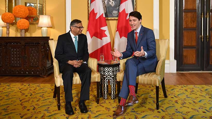 Canada's Prime Minister Justin Trudeau chats with Natarajan Chandrasekaran, the chairman of Indian conglomerate Tata Sons, in Mumbai on February 20, 2018