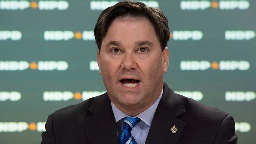 Don Davies, NDP MP and health critic, speaks during a news conference on blood plasma clinics in Ottawa in November 2016