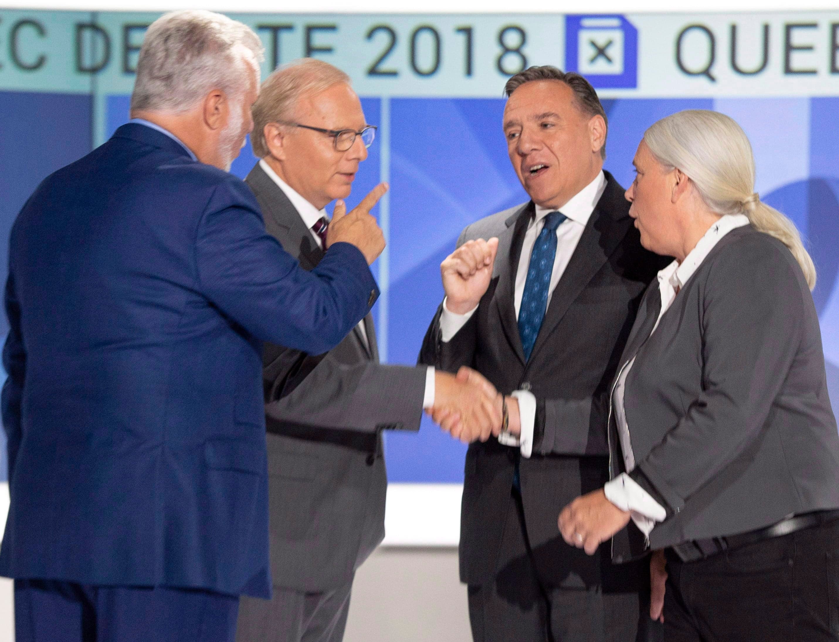 Quebec Liberal leader Philippe Couillard, left to right, PQ leader Jean-Francois Lisee, CAQ leader Francois Legault and Quebec Solidaire leader Manon Masse shake hands before their English debate September 17, 2018 in Montreal, Que. (Ryan Remiorz/CP)
