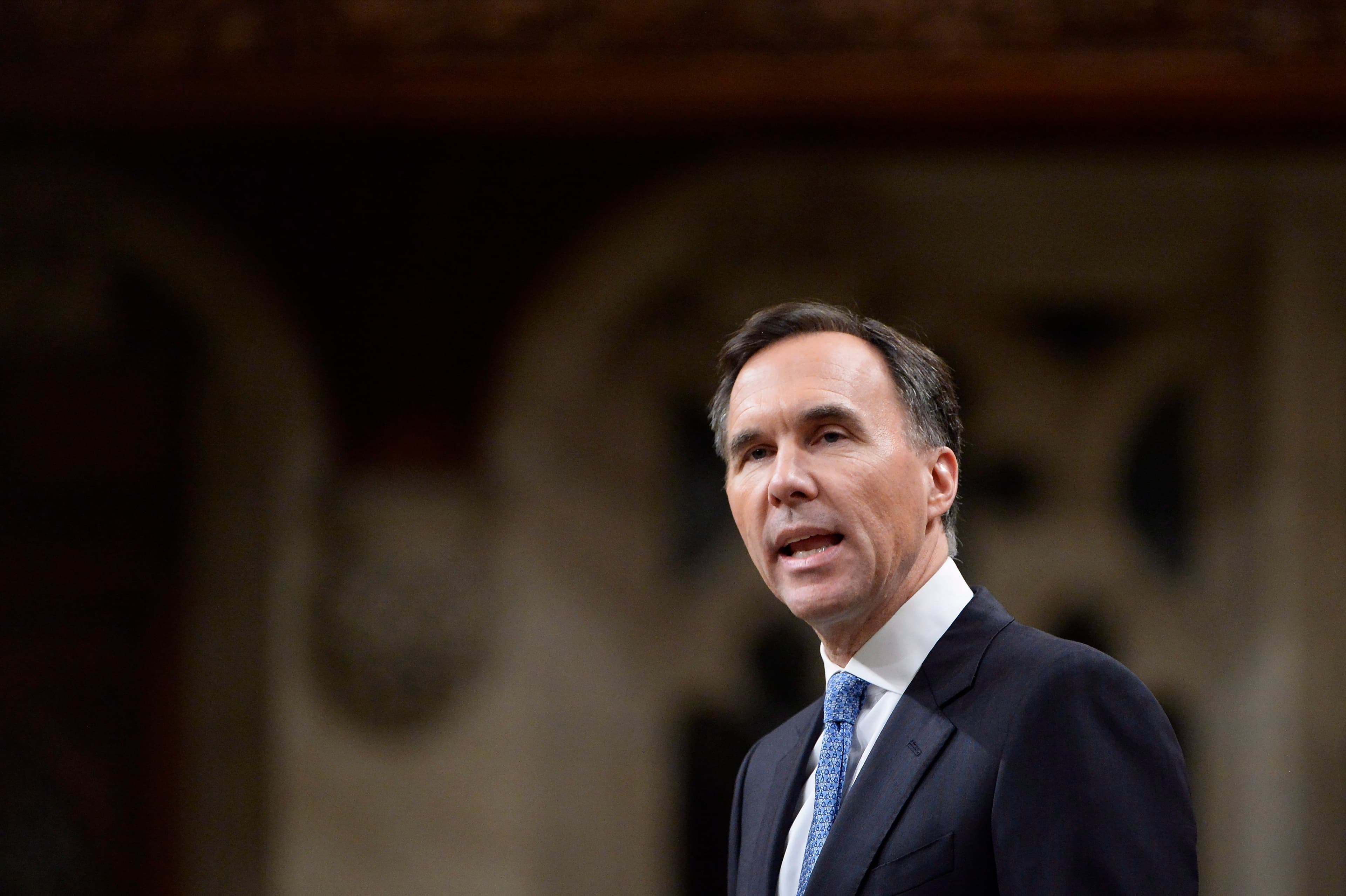 Bill Morneau looks at Trump's tax cuts—and says Canada won't play that game