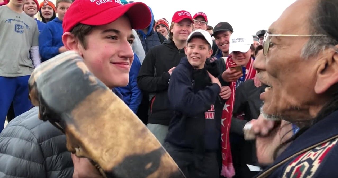 The many faces of a grinning young white man