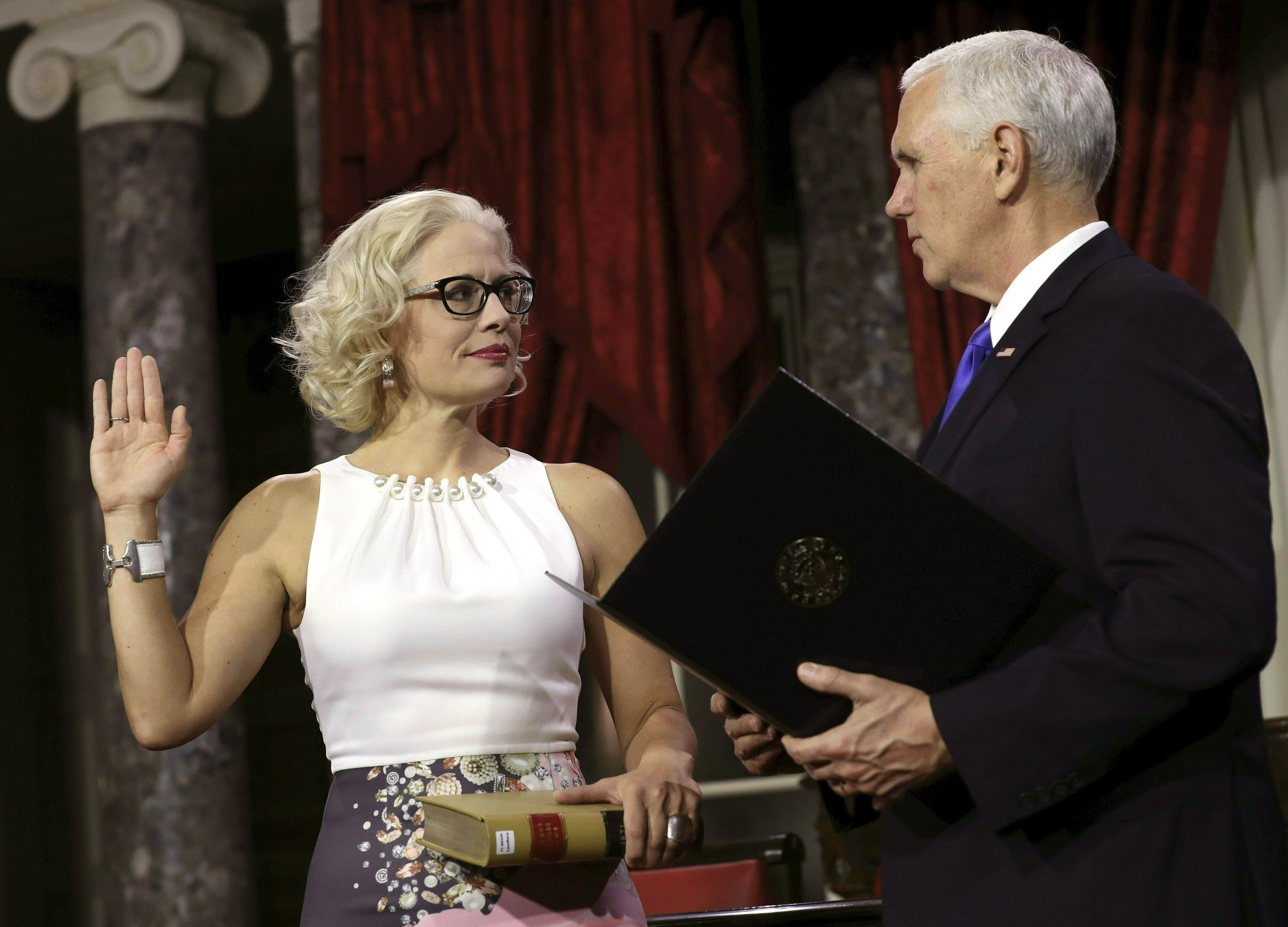 Kyrsten Sinema shows she's one adversary Mike Pence can't stare down