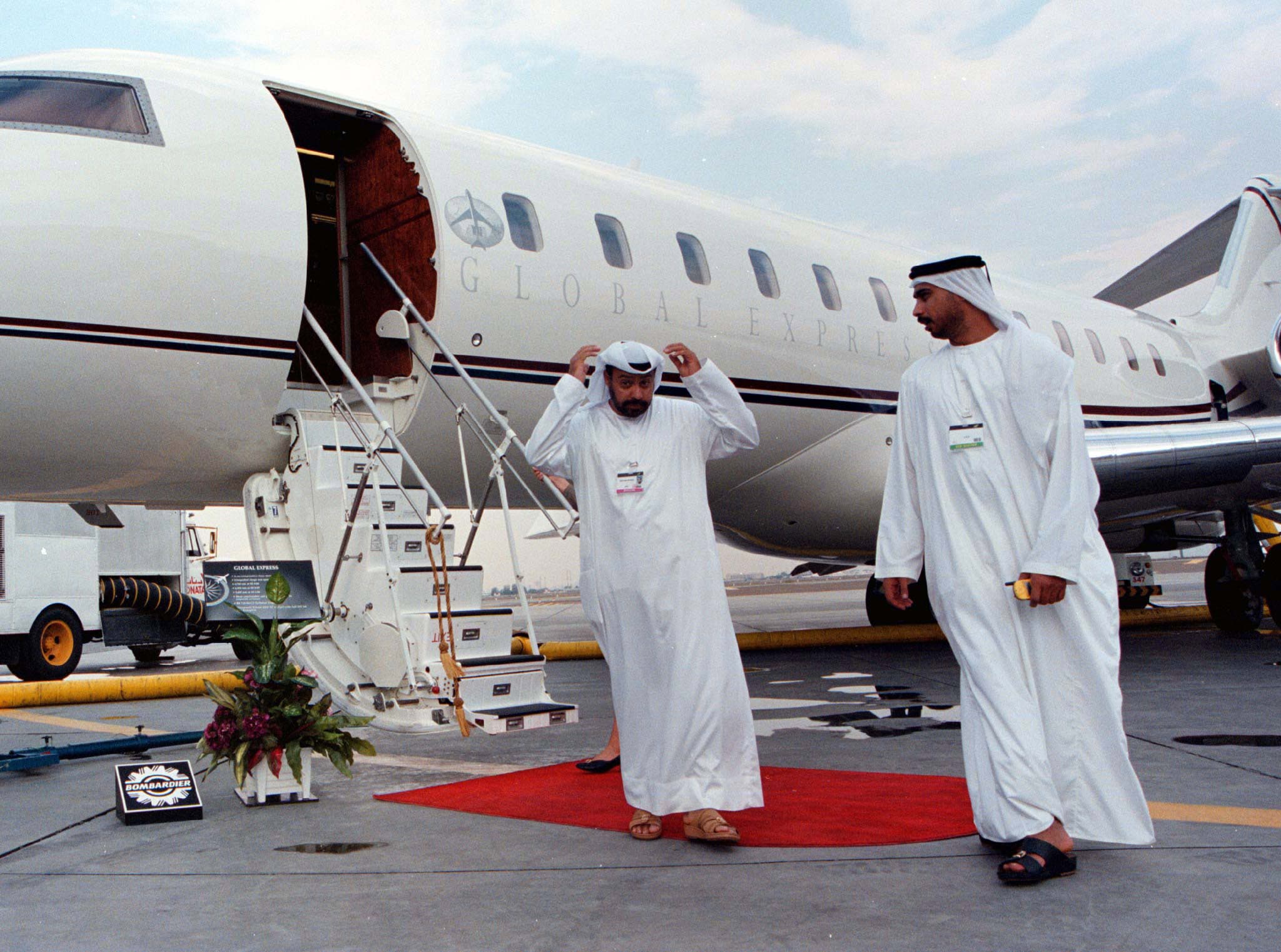 A visitor from the United Arab Emirates adjusts his headress at the final day of the Dubai air show November 20, after inspecting one of the newest long-range executive jets on show, Bombardier's Global Express. Business jet makers at the show said their products, costing up to $40 million, are not only the preserve of the rich and famous. (Ali Jarekji/Reuters)