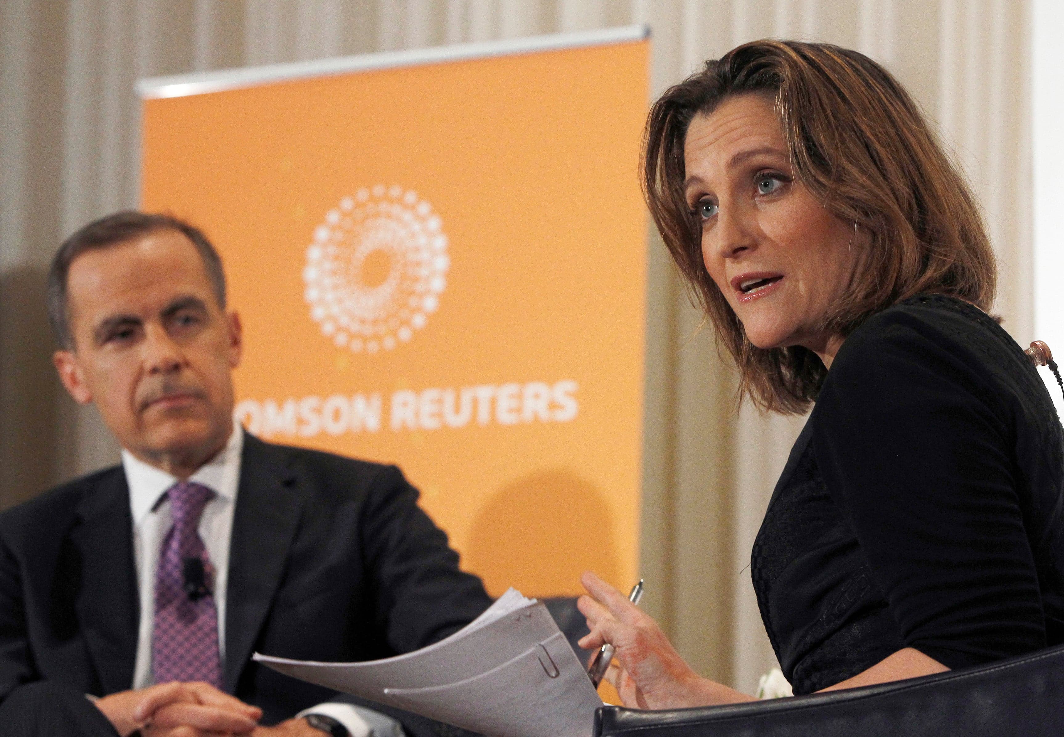 Bank of Canada Governor Mark Carney (L) is interviewed by Chrystia Freeland, Thomson Reuters Managing Director and Editor, Consumer News, at the National Press Club in Washington April 18, 2013. (Gary Cameron/Reuters)