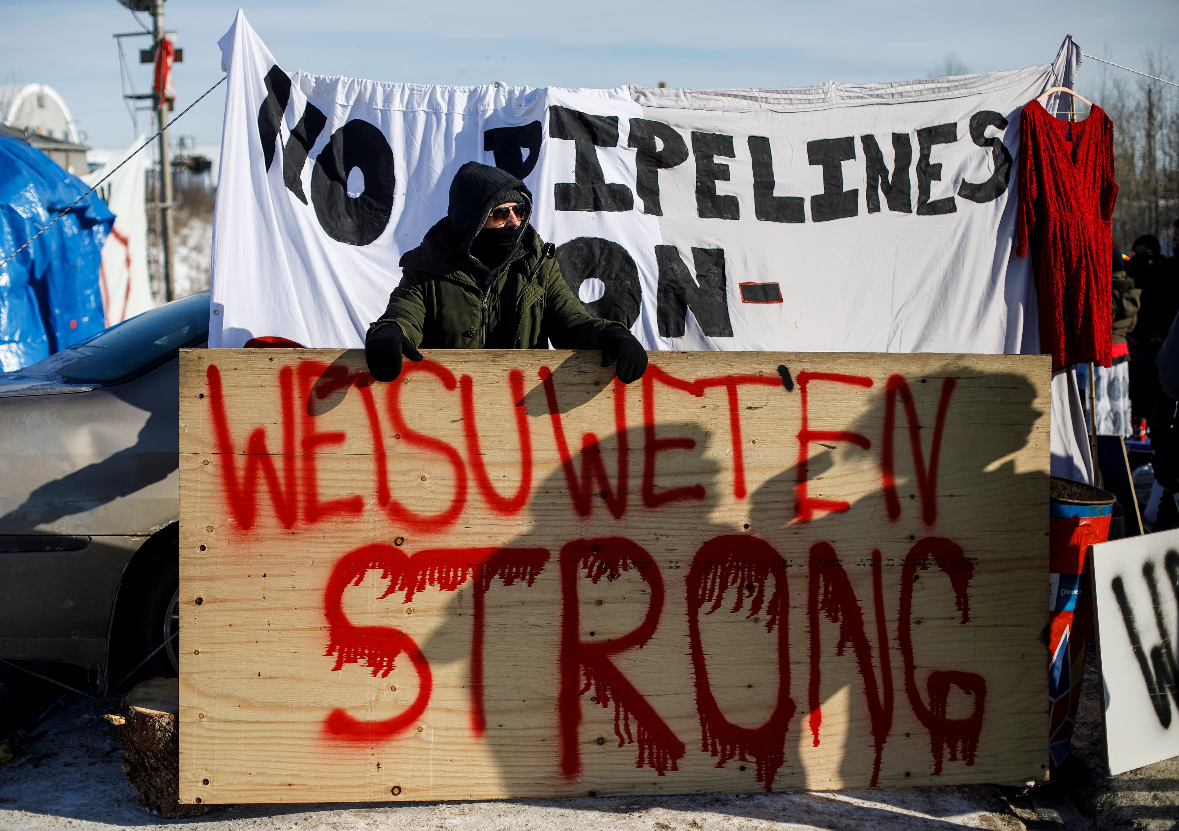 Supporters of the Wet'suwet'en hereditary chiefs block a CN Rail line just west of Edmonton Alta, on Wednesday February 19, 2020. (Jason Franson/CP)