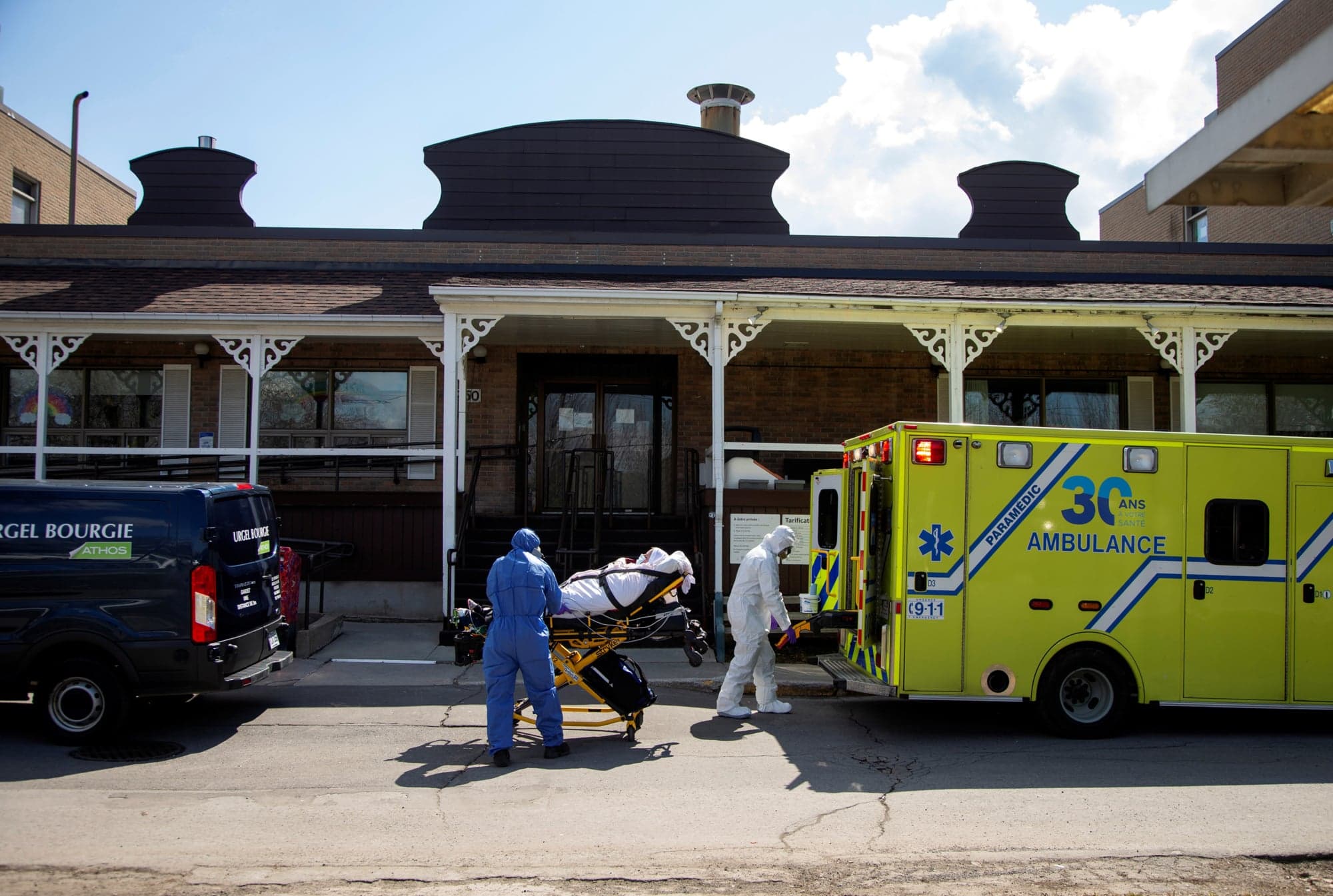 Ambulance attendants transport a resident from Centre d'hebergement Yvon-Brunet, a seniors' long-term care centre, amid the outbreak of COVID-19, in Montreal, Qc., in April 2020. (Christinne Muschi/Reuters)