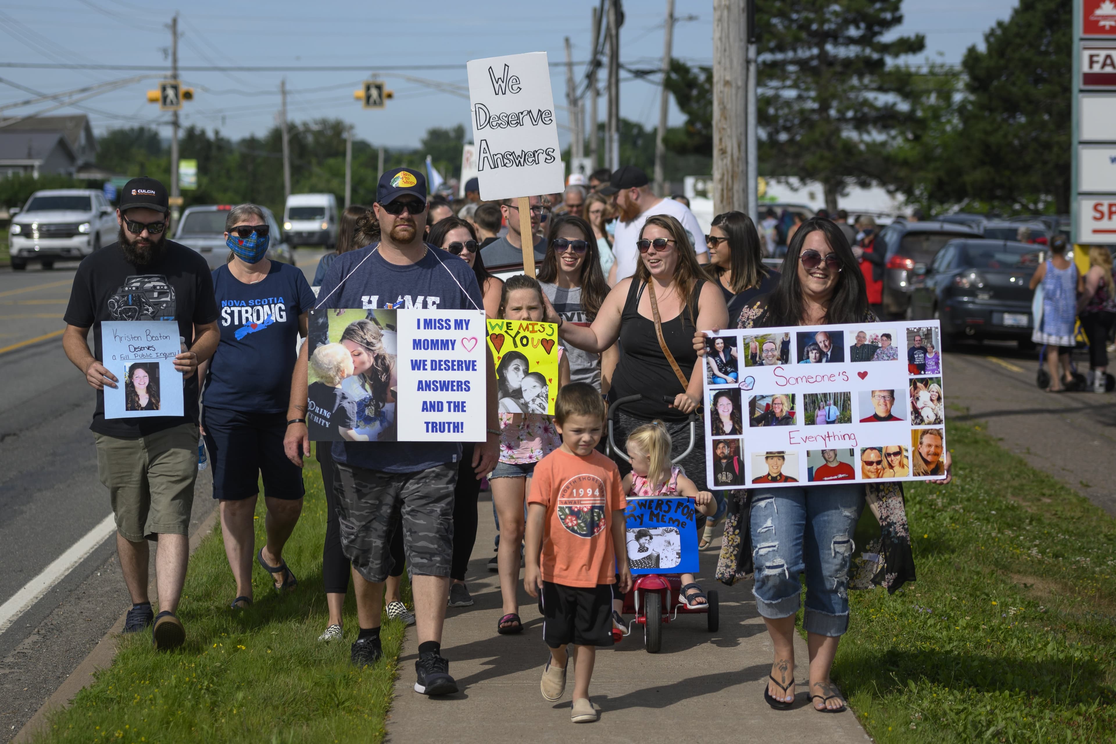 Darcy Dobson (front right), daughter of Heather O'Brien, marches with family, friends, and loved ones of shooting victims in Bible Hill, N.S. on Wednesday, July 22, 2020 demanding a public inquiry into the RCMP's handling of Canada's deadliest rampage throughout rural Nova Scotia in April. Darren Calabrese