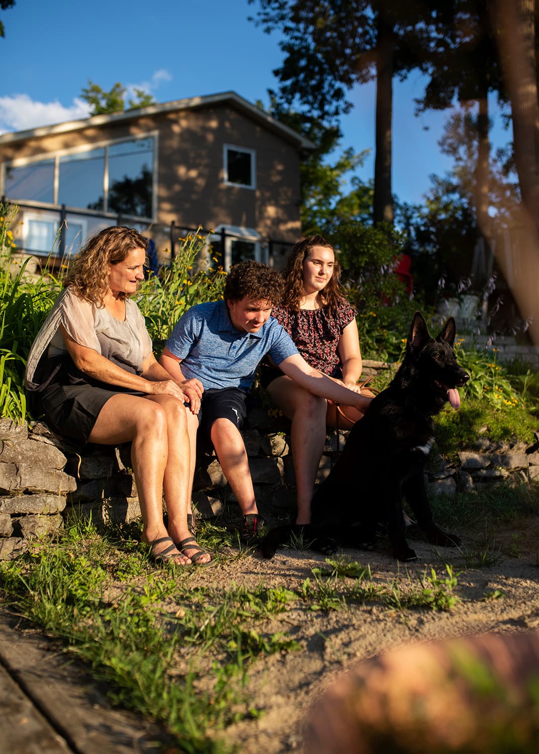 Robbyn Plumb is photographed with her children Carson, 14, and Morgan, 16, and German Shepherd, Nova. (Photograph by Sarah Dea)