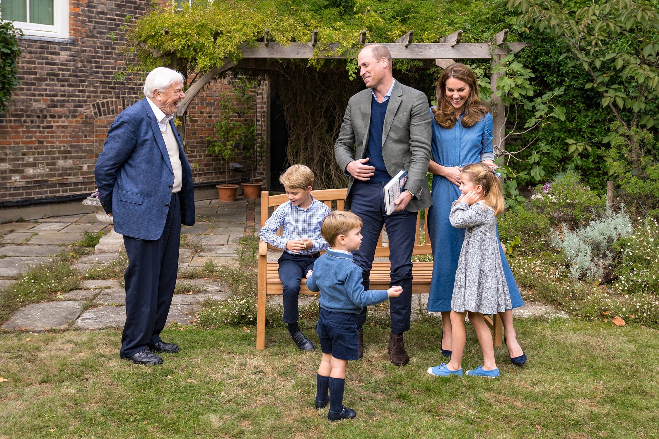 The Cambridges are intensely private, and glimpses of their children, like these photos taken of a meeting with Sir David Attenborough (left), spark delight in the public when shared (Kensington Palace/Getty Images)