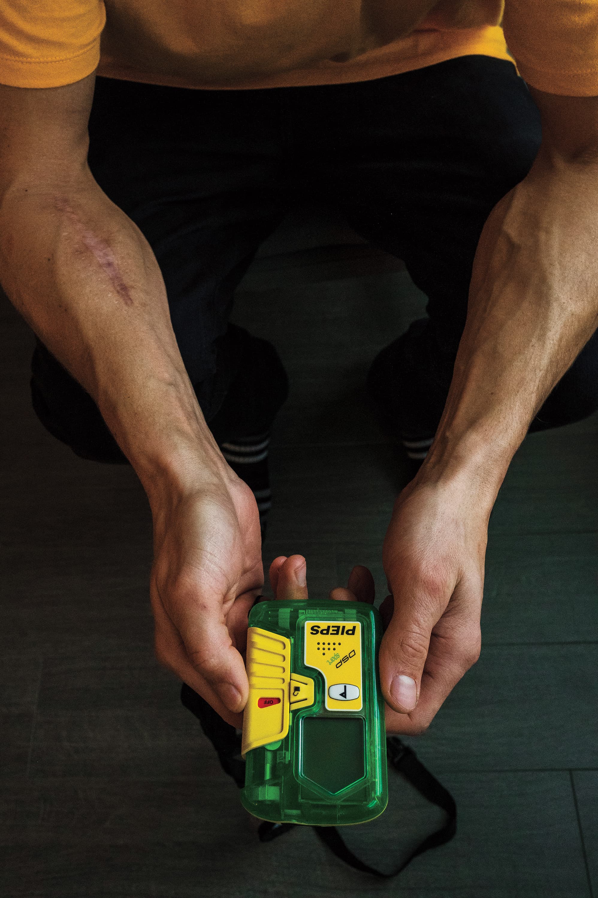 McNutt holds a DSP Pro, the same model that failed him (Photograph by Felicia Chang)