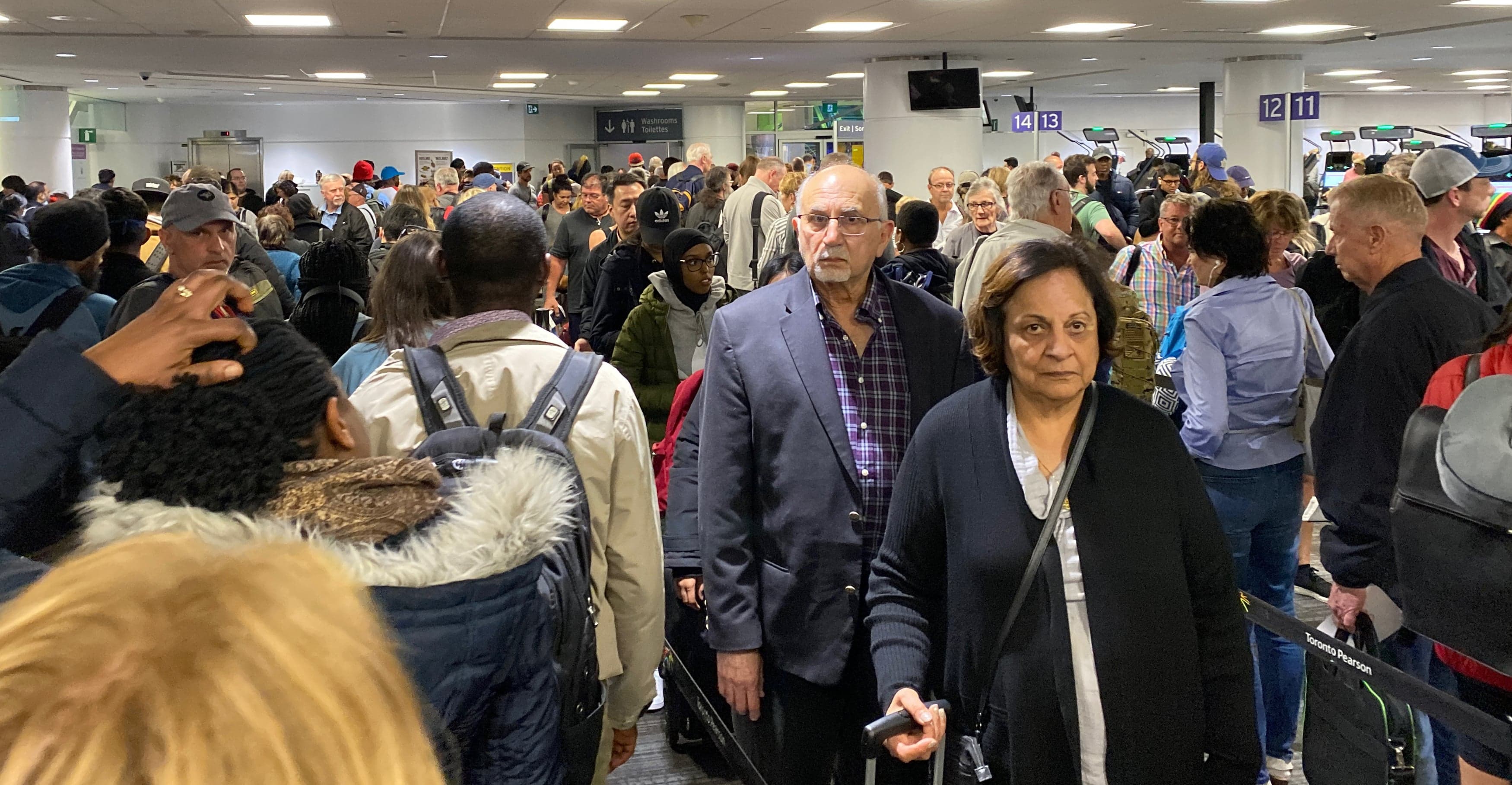 Toronto’s Pearson International Airport, on March 14, 2020, was packed with crowds of unmasked people as Canadians returned home (Glen Canning)