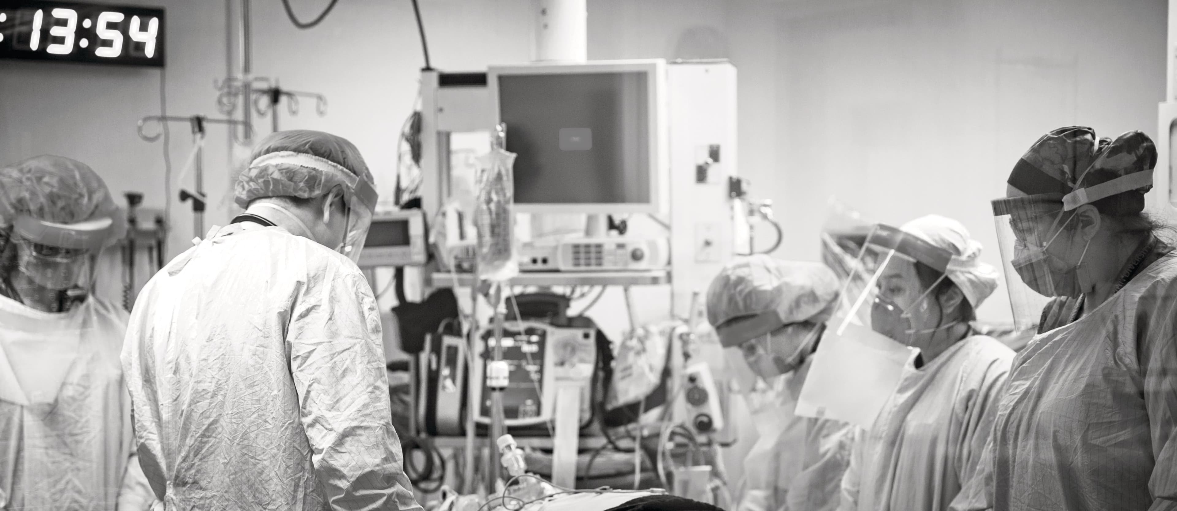 (L to R) Code Team Leader Dr. Layli Sanaee, Emergency physician Dr. Derrick Chang, respiratory therapist Mooska Mayel, and registered nurses Dalena Dang and Ashley Mitchell, pause in a moment of respect for the patient at the time of death. (Dawn Lim)