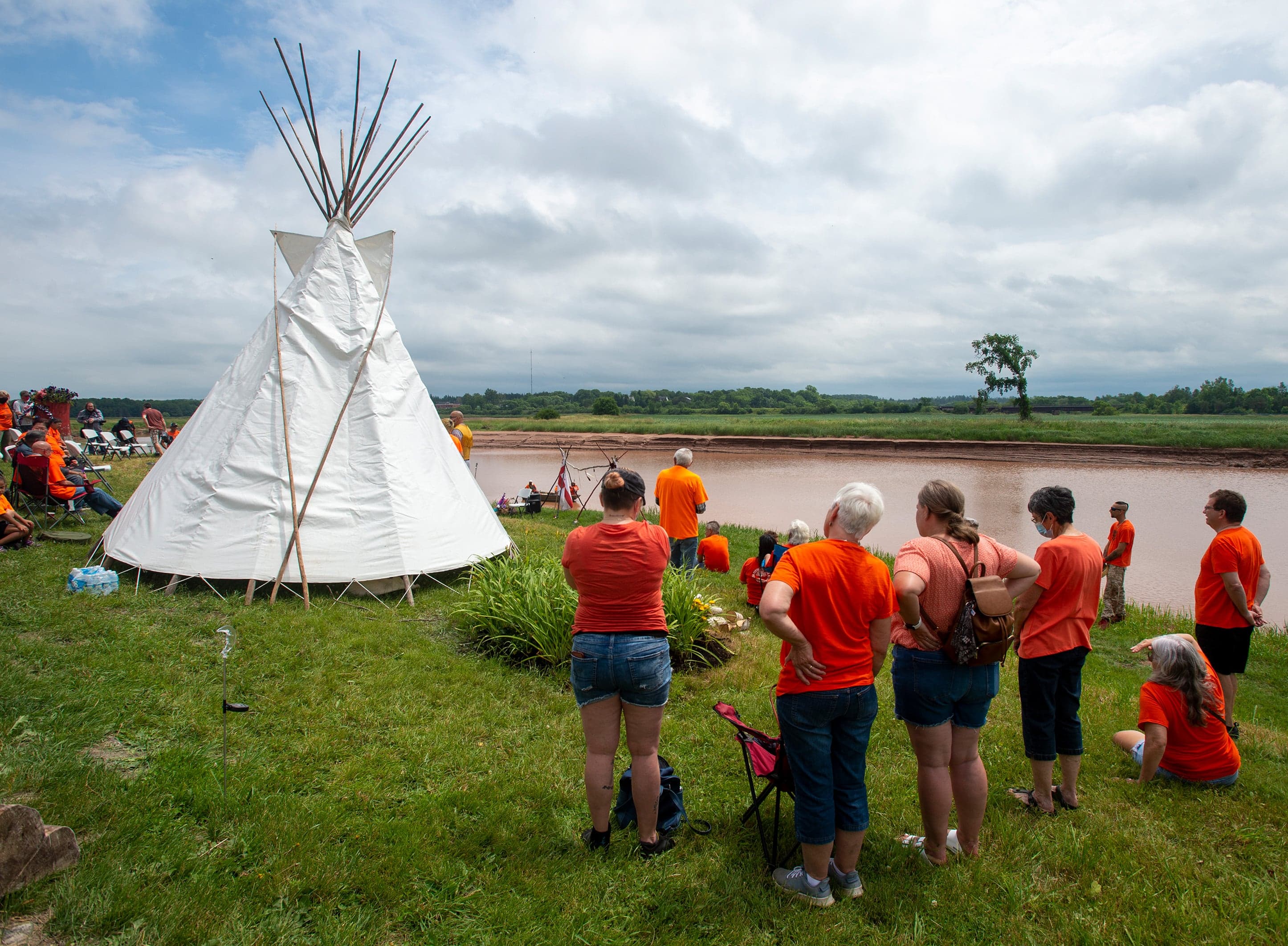 Members of the Sipekne’katik First Nation pay their respects to the survivors and victims of the residential school system in Shubenacadie, N.S. on Thursday, July 1, 2021. (Andrew Vaughan/CP)