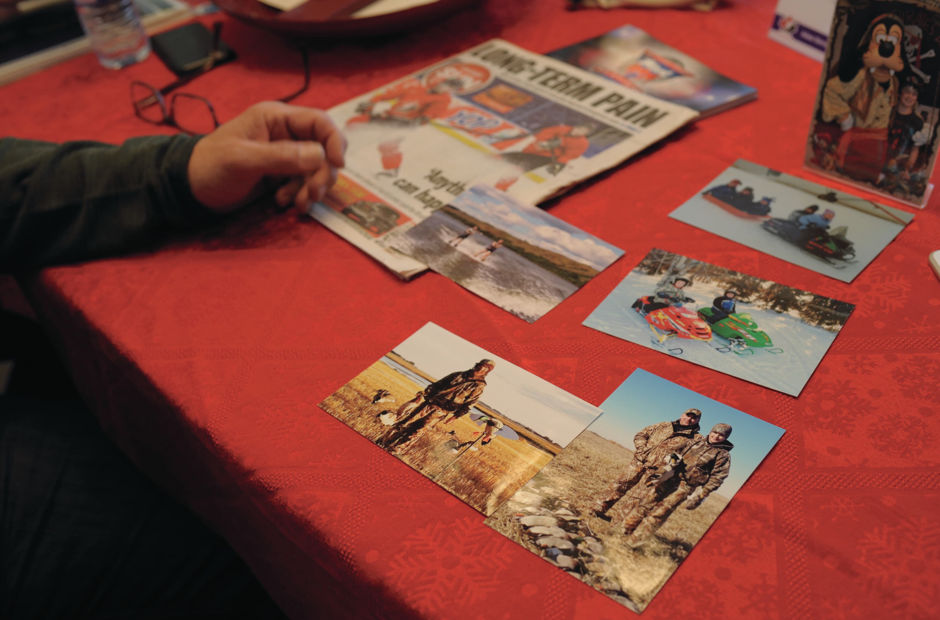 Russell Herold goes through family photos (Photograph by Mark Taylor)
