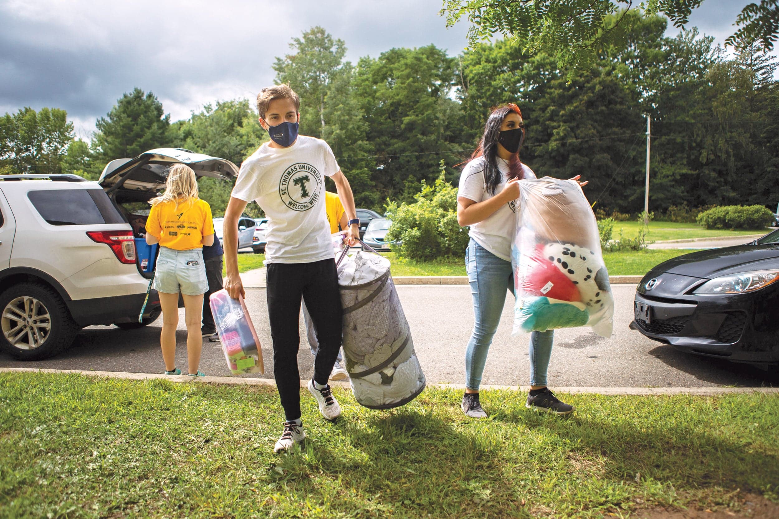 A volunteer helps a new student move into residence at St. Thomas University in Fredericton; universities are seeing an increase in demand for student housing(Photograph by Chris Donovan)