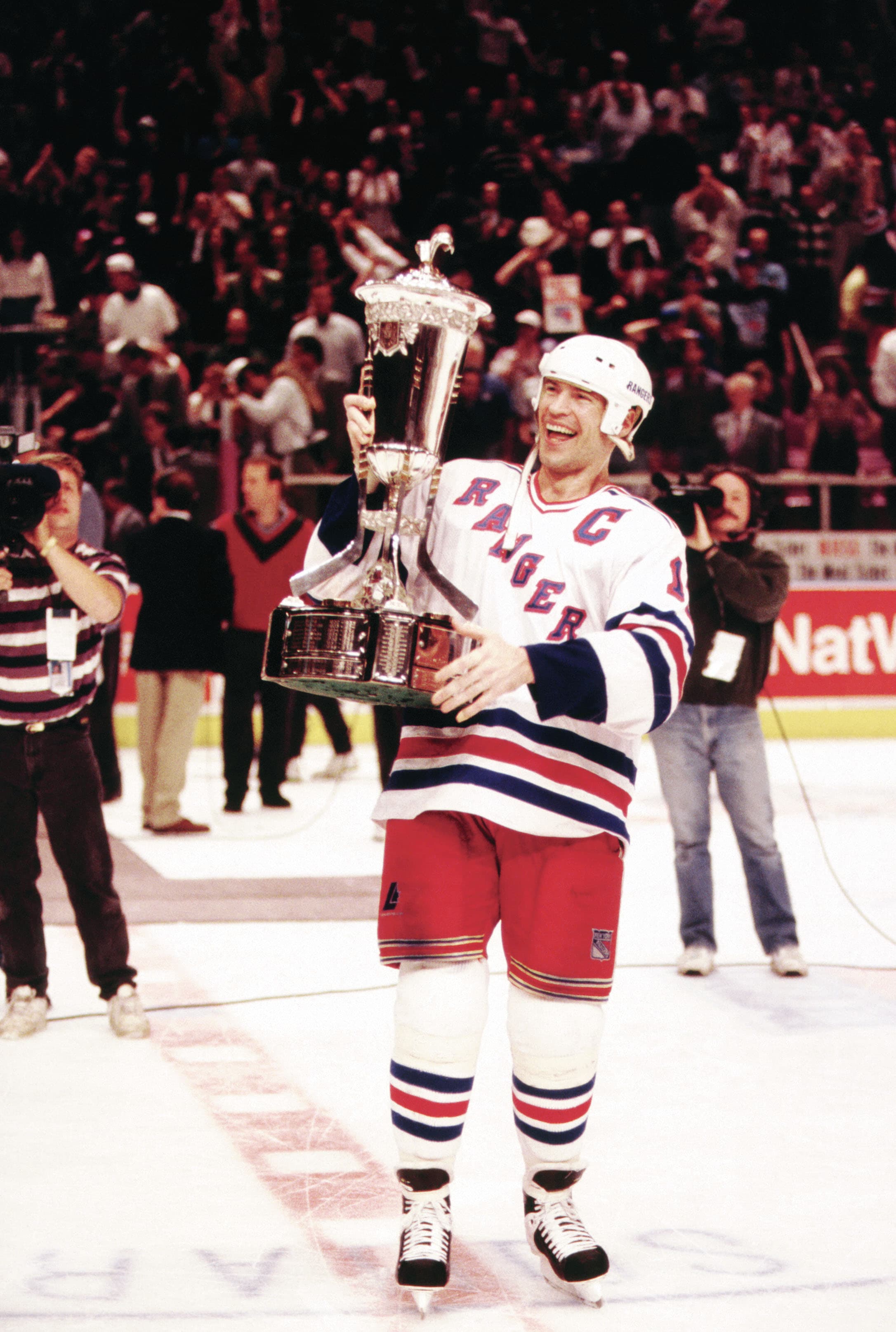 Mark Messier #11 of the New York Rangers holds the Prince of Wales Trophy after the Rangers defeated the New Jersey Devils in Game 7 of the Eastern Conference Finals on May 27, 1994 at the Madison Square Garden in New York, New York (B Winkler/Bruce Bennett Studios/Getty Images)