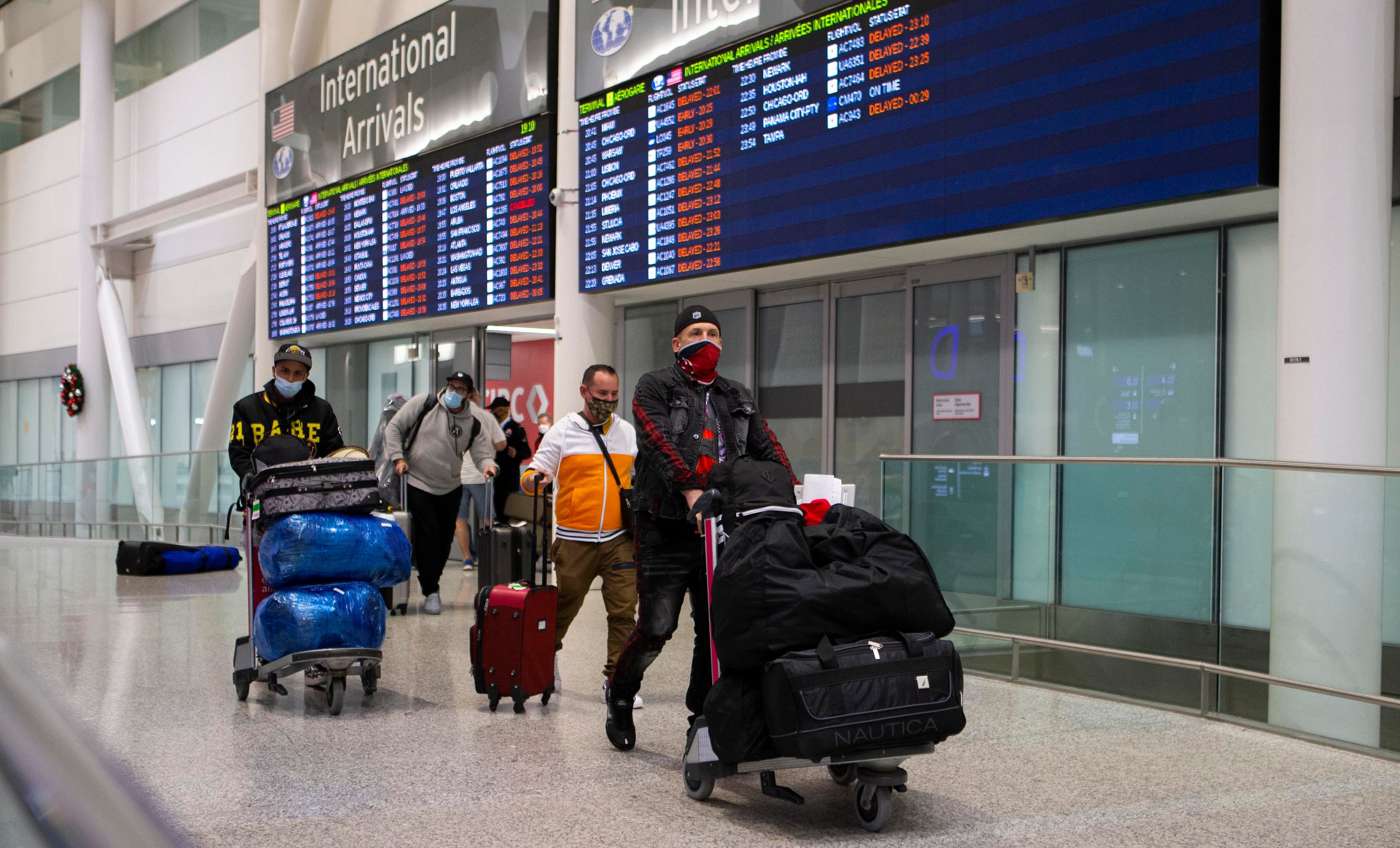 Canada announces new travel restrictions as the world braces for Omicron