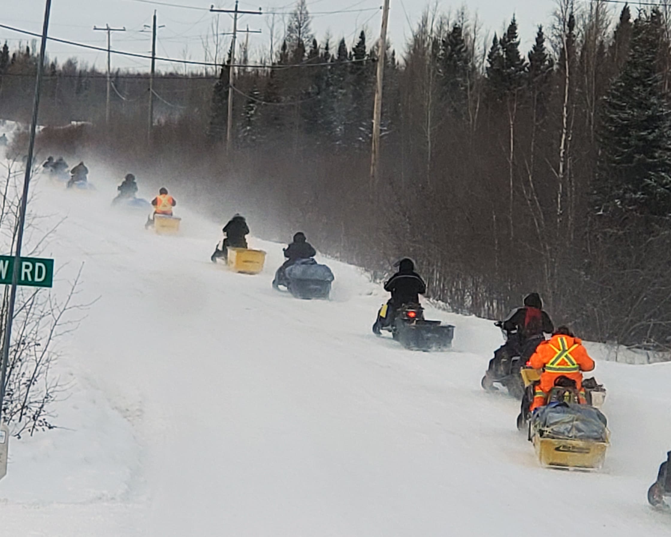 A Ski-Doo train packed with courage, care and badly needed supplies