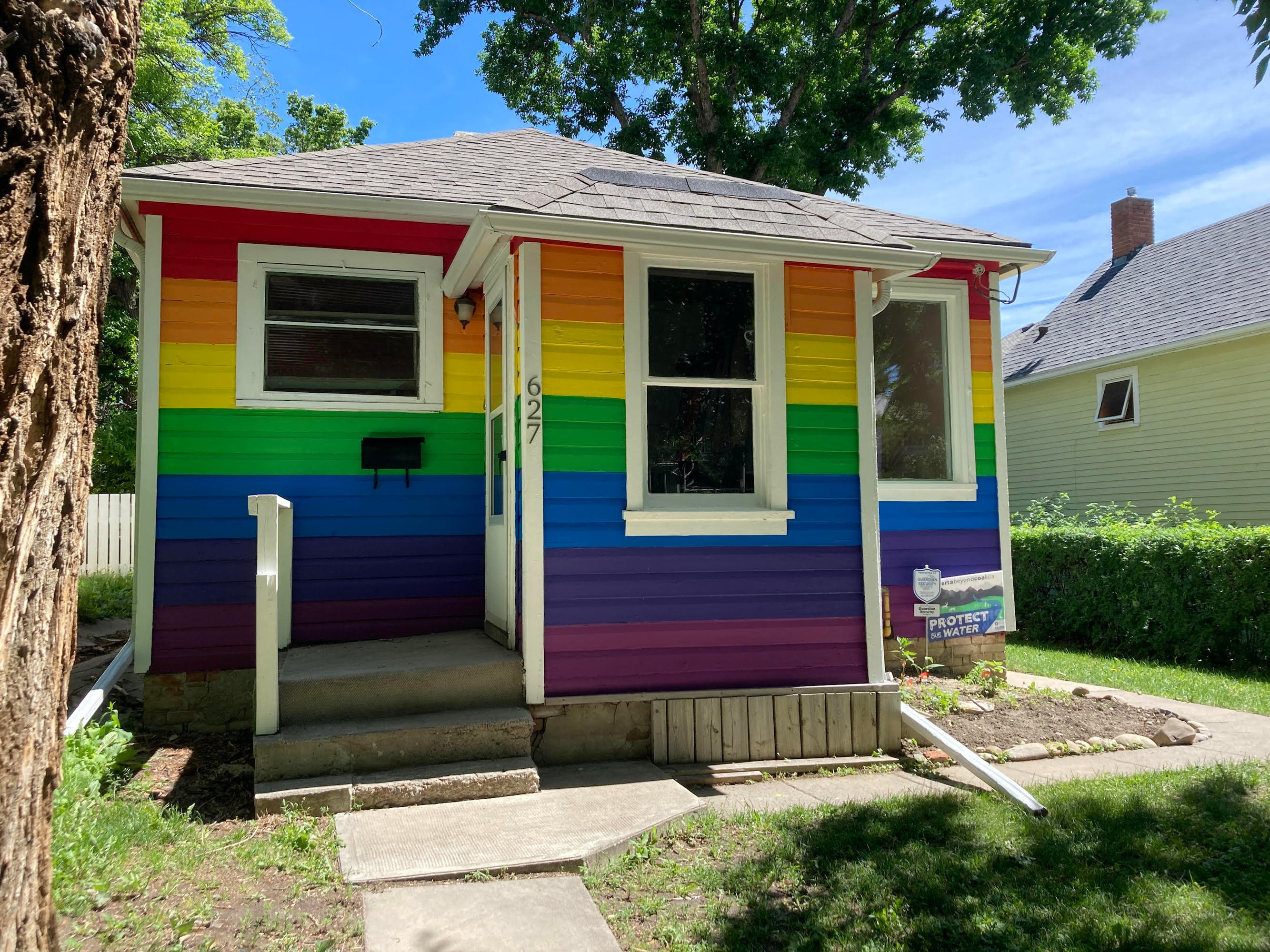 A rainbow house beaming with Pride