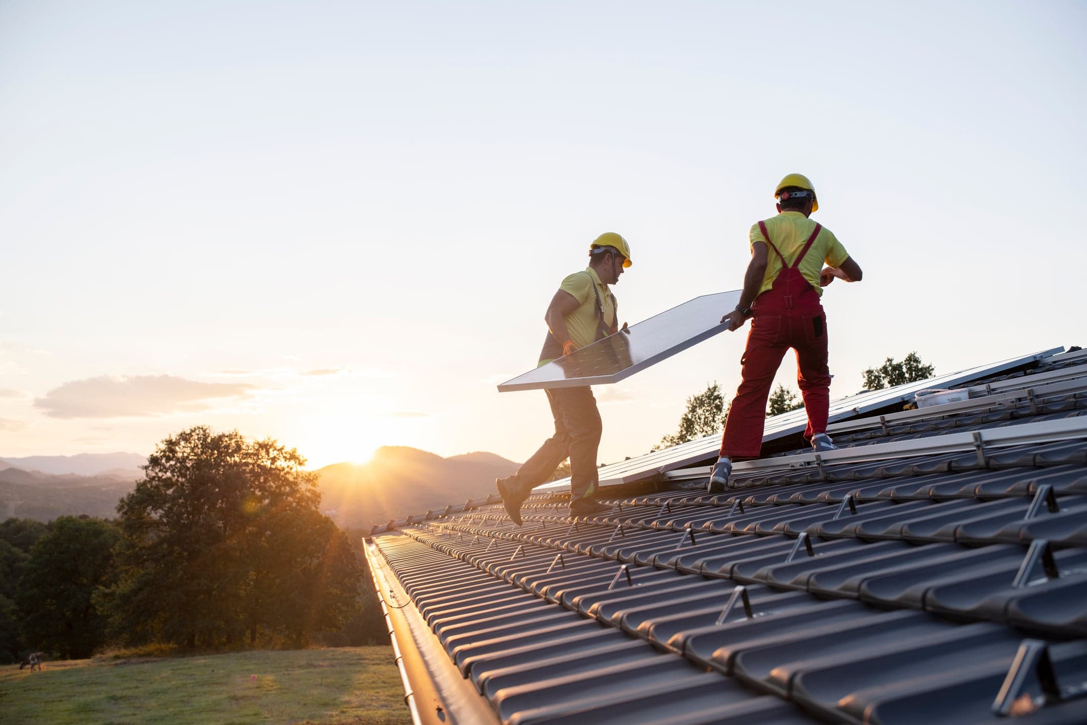 Installation of solar panels on a roof.