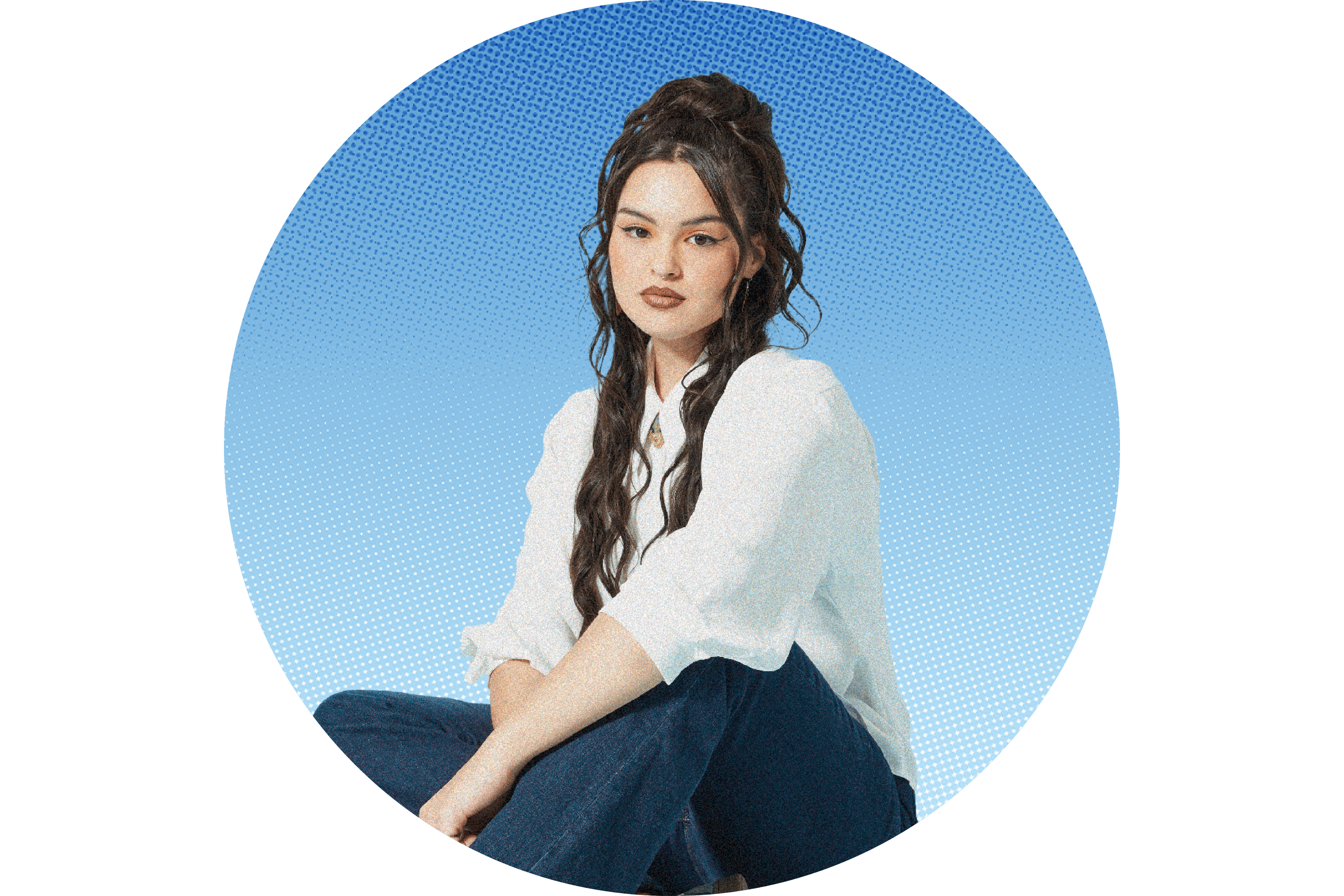 Anna Lambe in a white top and blue pants