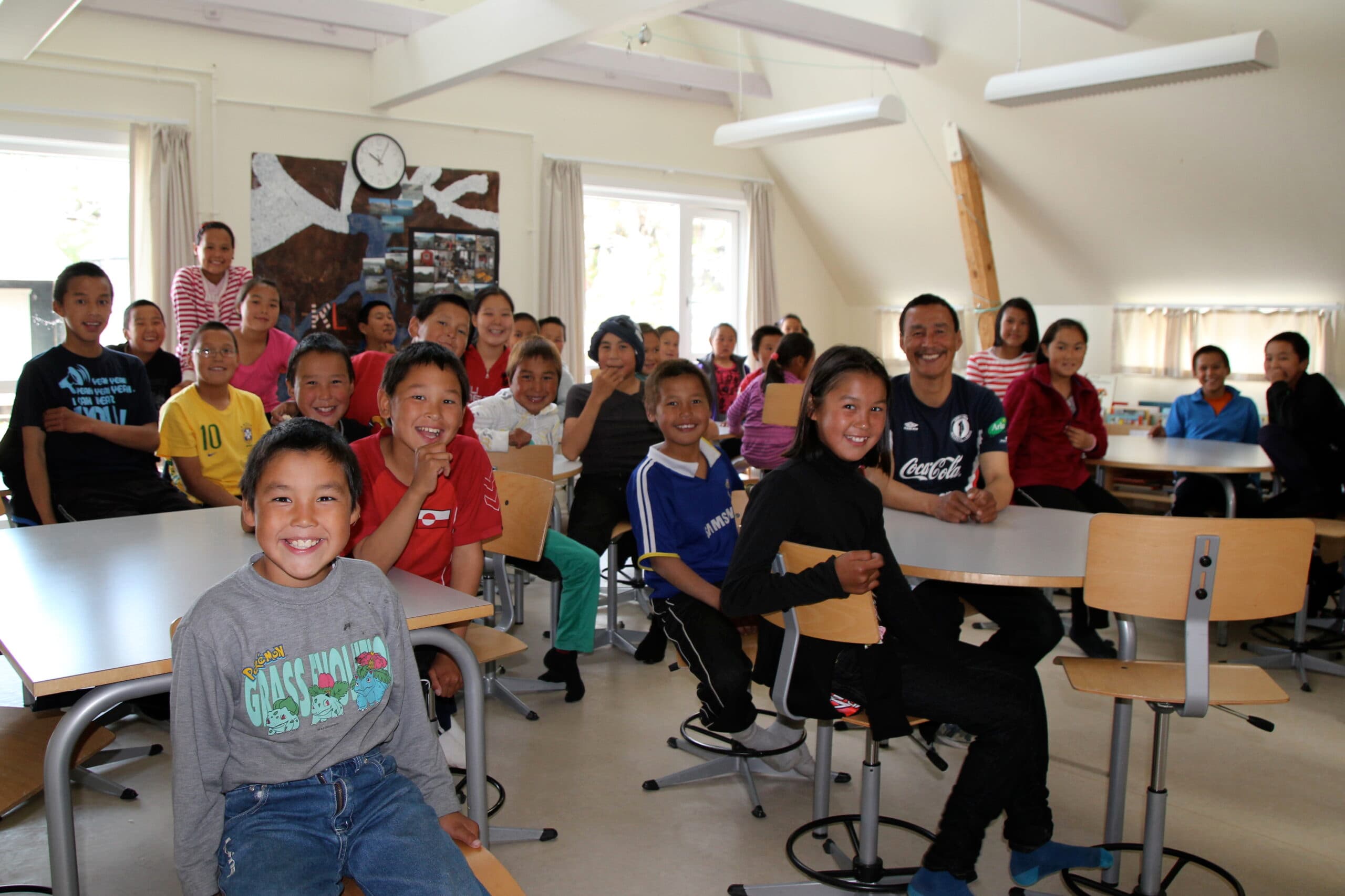 A classroom full of excited-looking kids