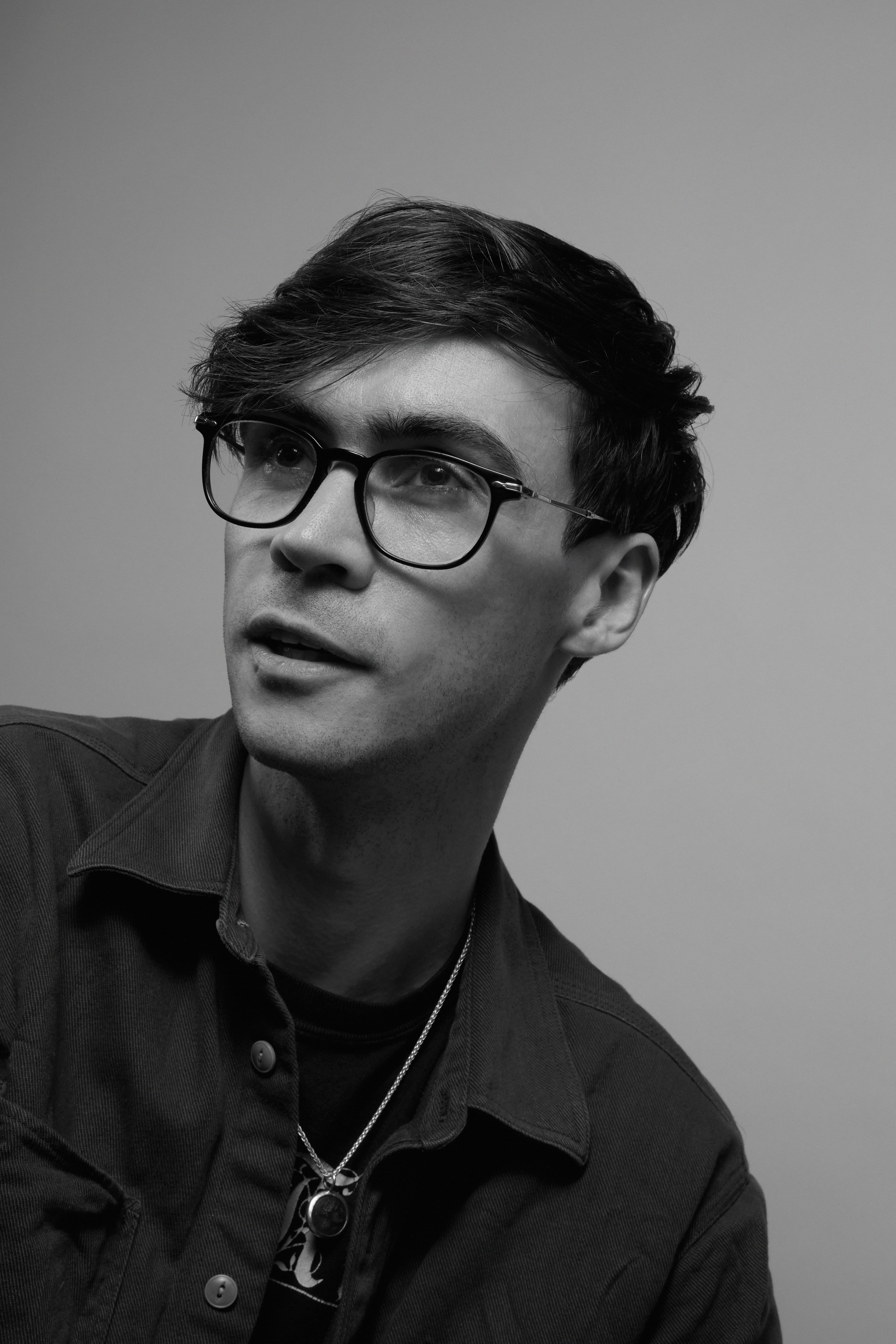 Nick Frosst in a black t-shirt and glasses